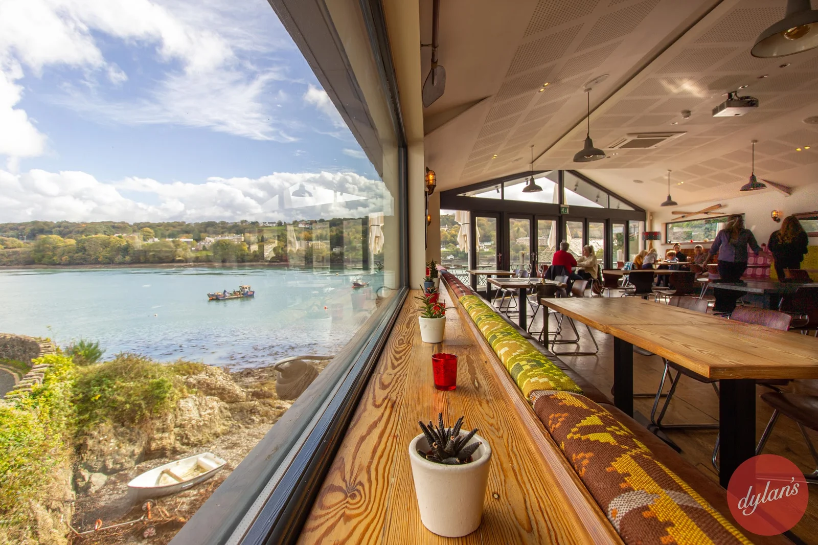 Dylan's restaurant floor-to-ceiling windows overlooking the Menai Straits and Menai Suspension Bridge