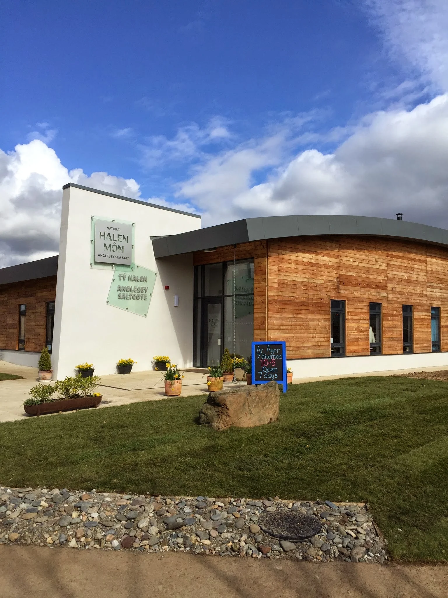 Halen Môn sea salt crystals in a bowl with the Menai Strait visible through the production facility windows