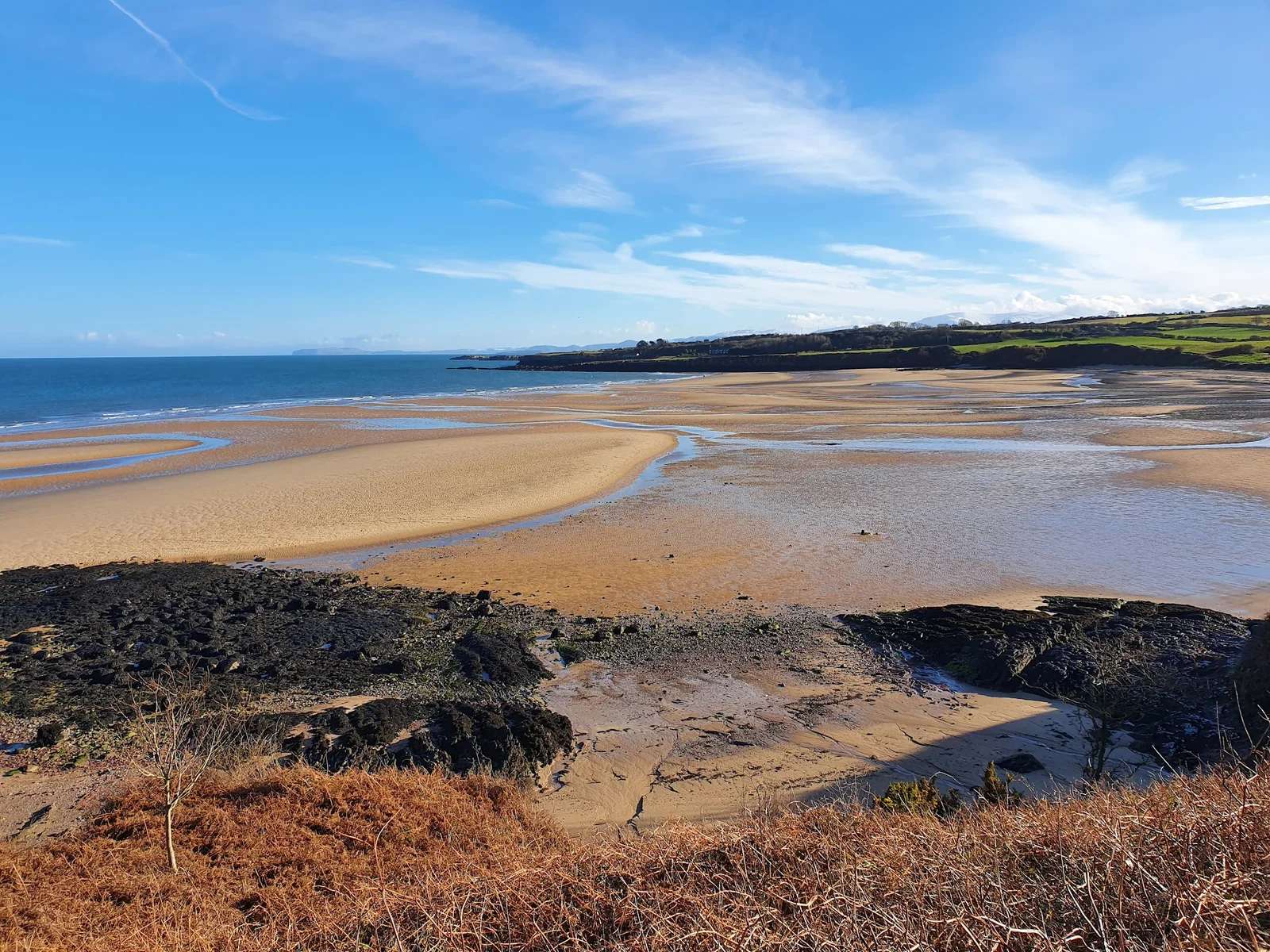 Lligwy Beach broad sandy arc on the northeast coast of Anglesey near Moelfre