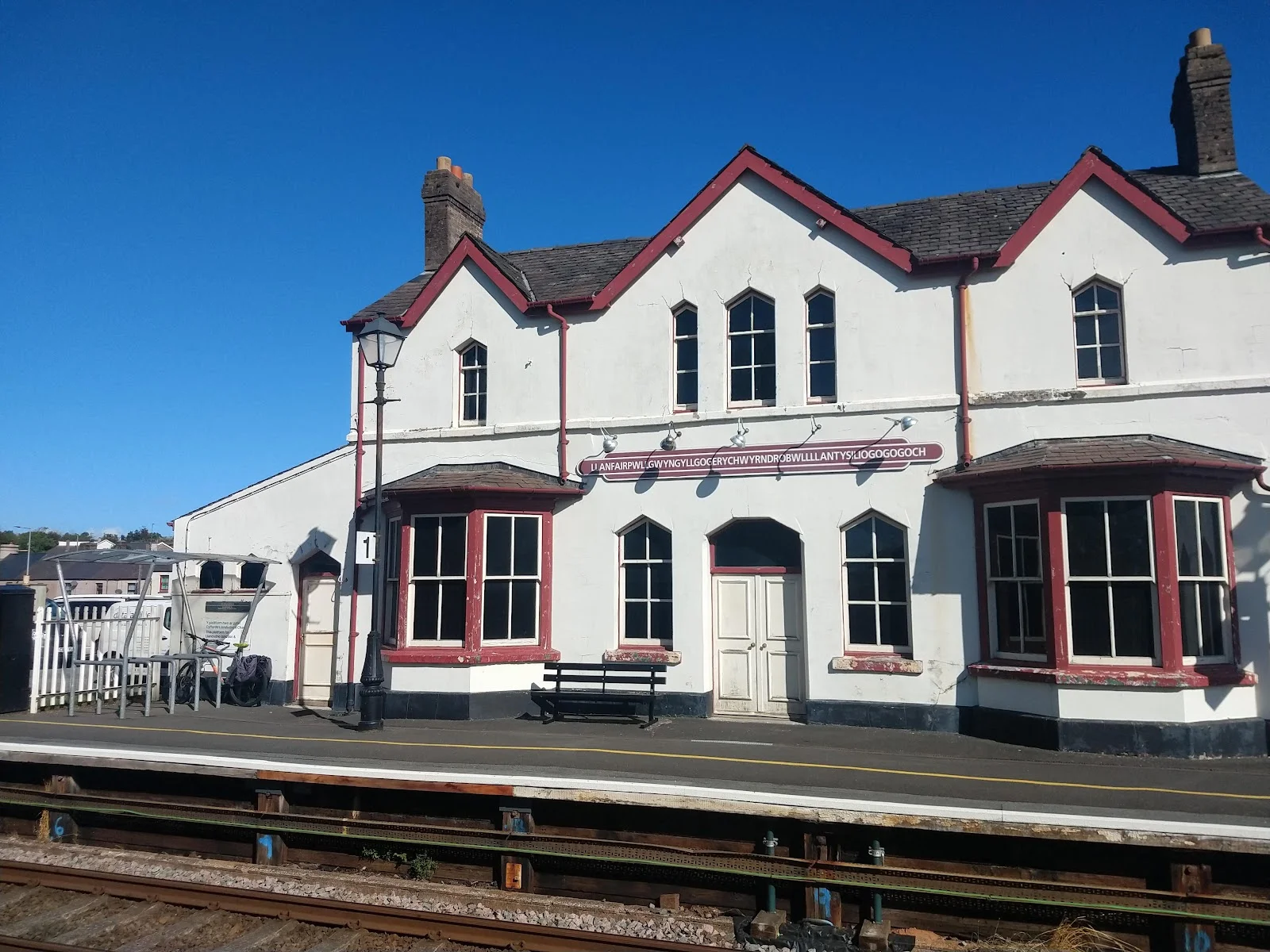 Llanfairpwll railway station with its famously long village name sign, Anglesey